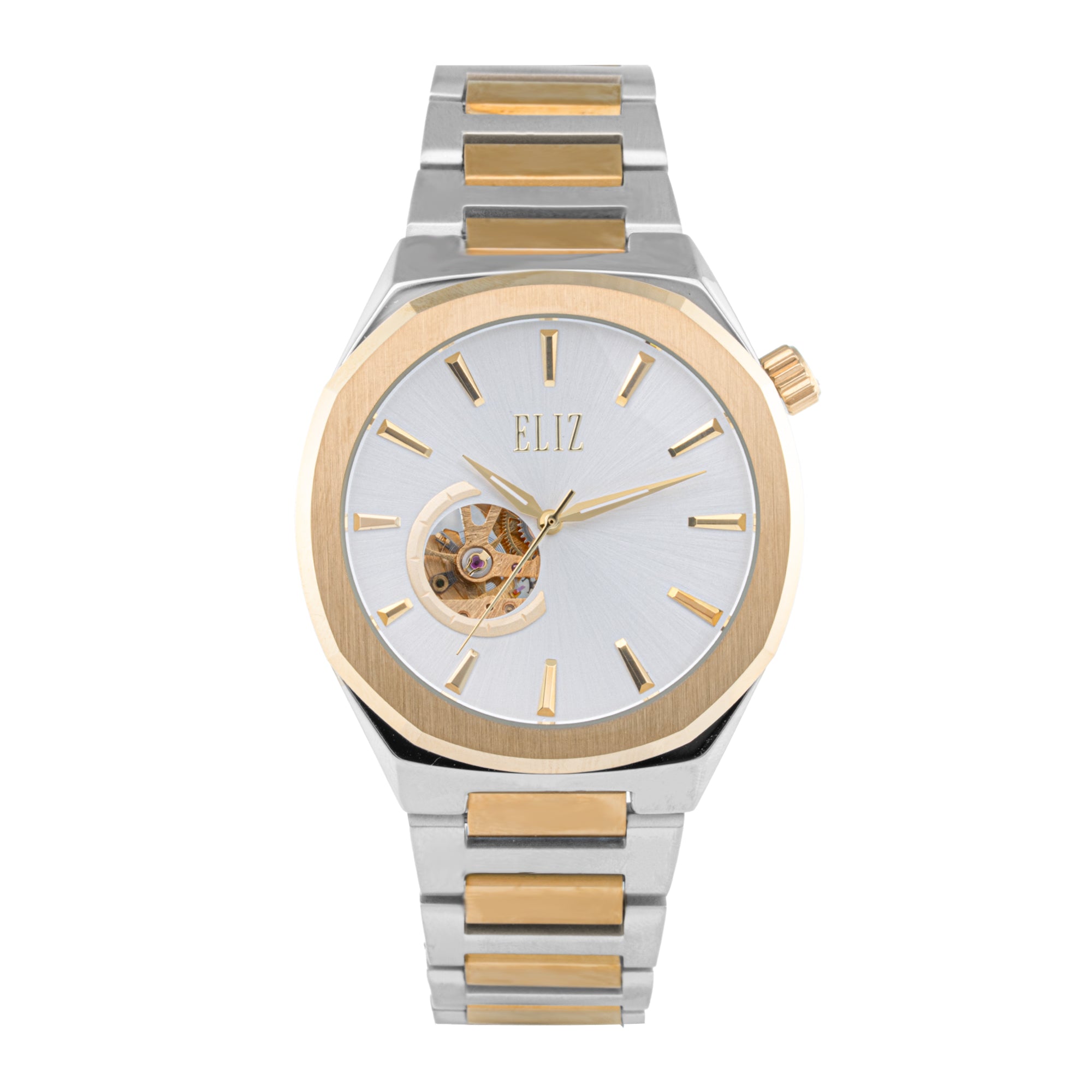 ELIZ ES8874G2TST – Désir Collection – Round – 44mm Superior Metal Case – TT PVD Gold Plating – Hardened Mineral Glass – Silver Dial – Skeleton Automatic Mechanical Movement – 25x20mm TT PVD Gold Stainless Steel Band – Hidden Deployant with Pushers Buckle – 3ATM Water Resistant – Men's Watch – 2 Years Warranty